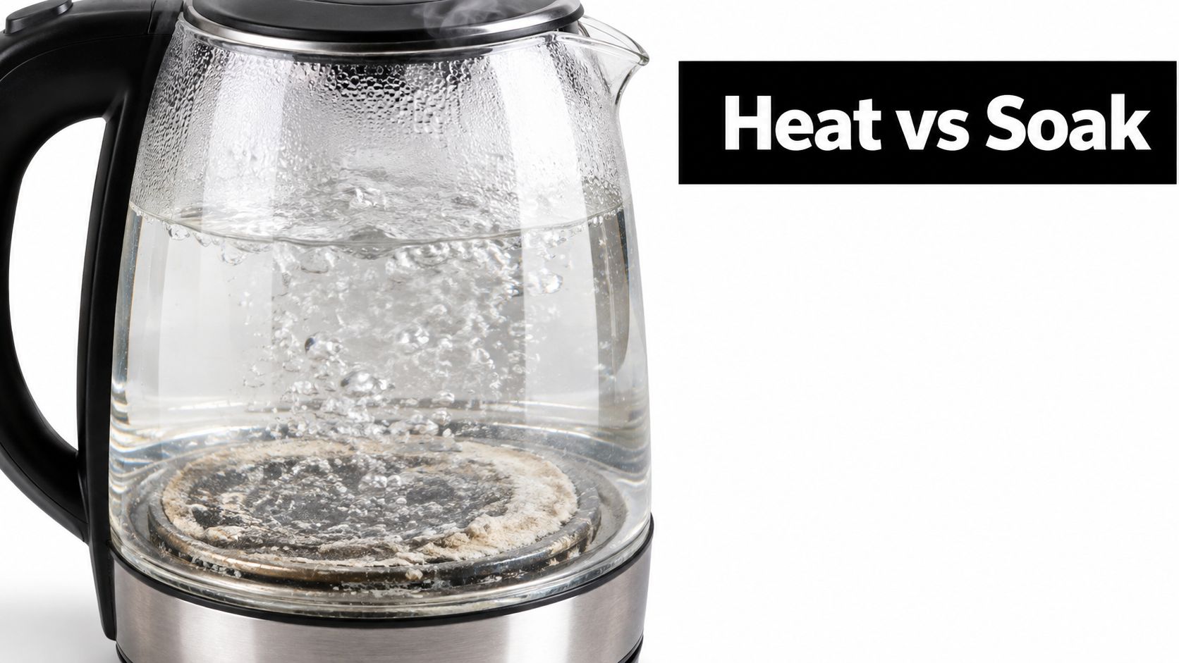 A glass electric kettle filled with boiling water showing significant white mineral limescale buildup on the base.
